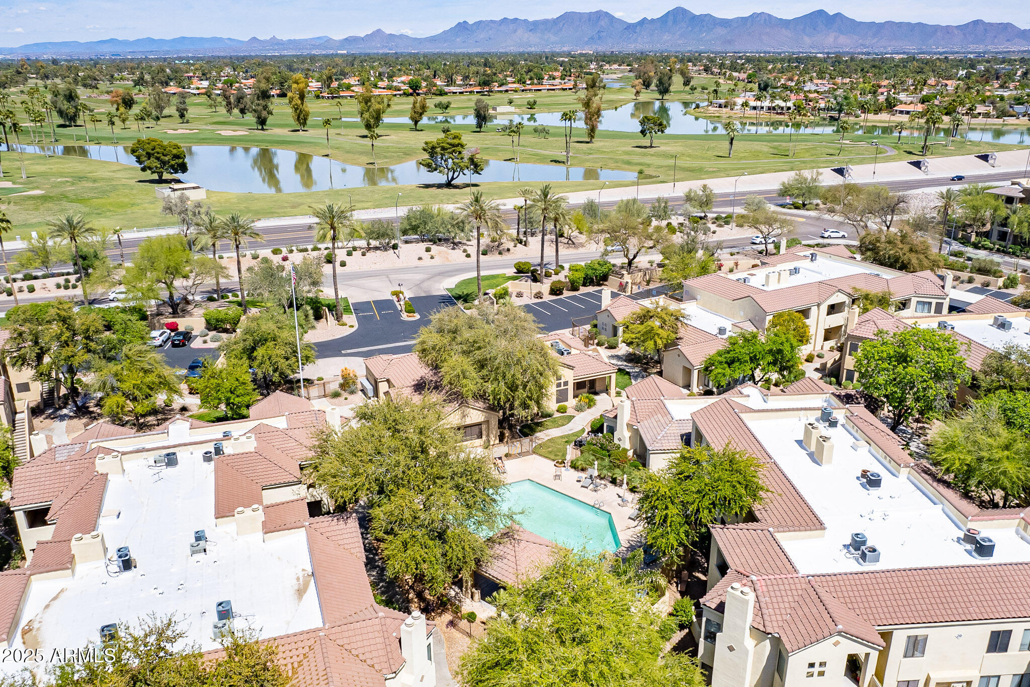 7575 East Indian Bend Road, Unit 2124 Scottsdale, AZ 85250 - Photo 30 of 32 an aerial view of residential houses with outdoor space