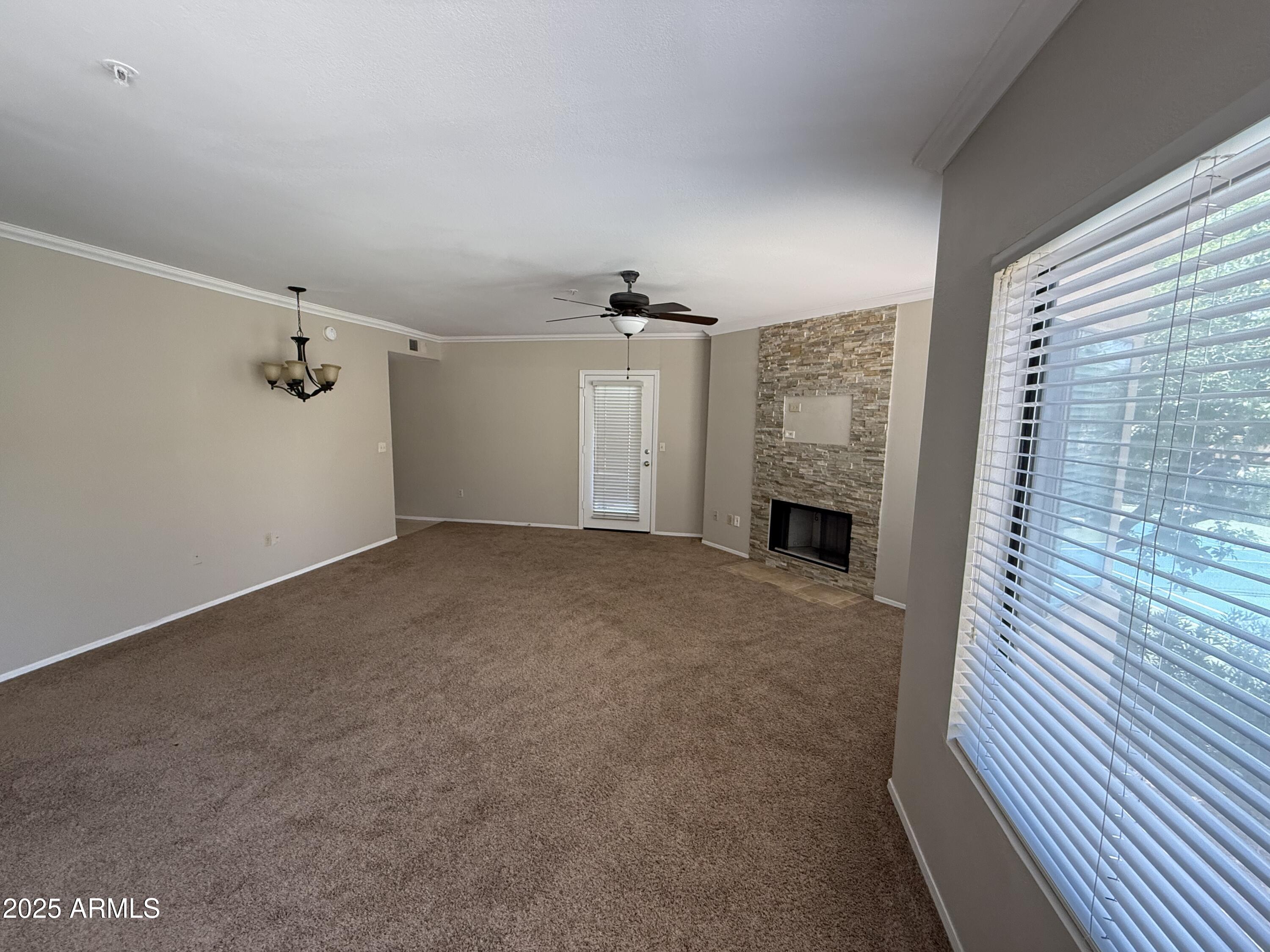 7575 East Indian Bend Road, Unit 2124 Scottsdale, AZ 85250 - Photo 3 of 32 a view of a livingroom with a fireplace