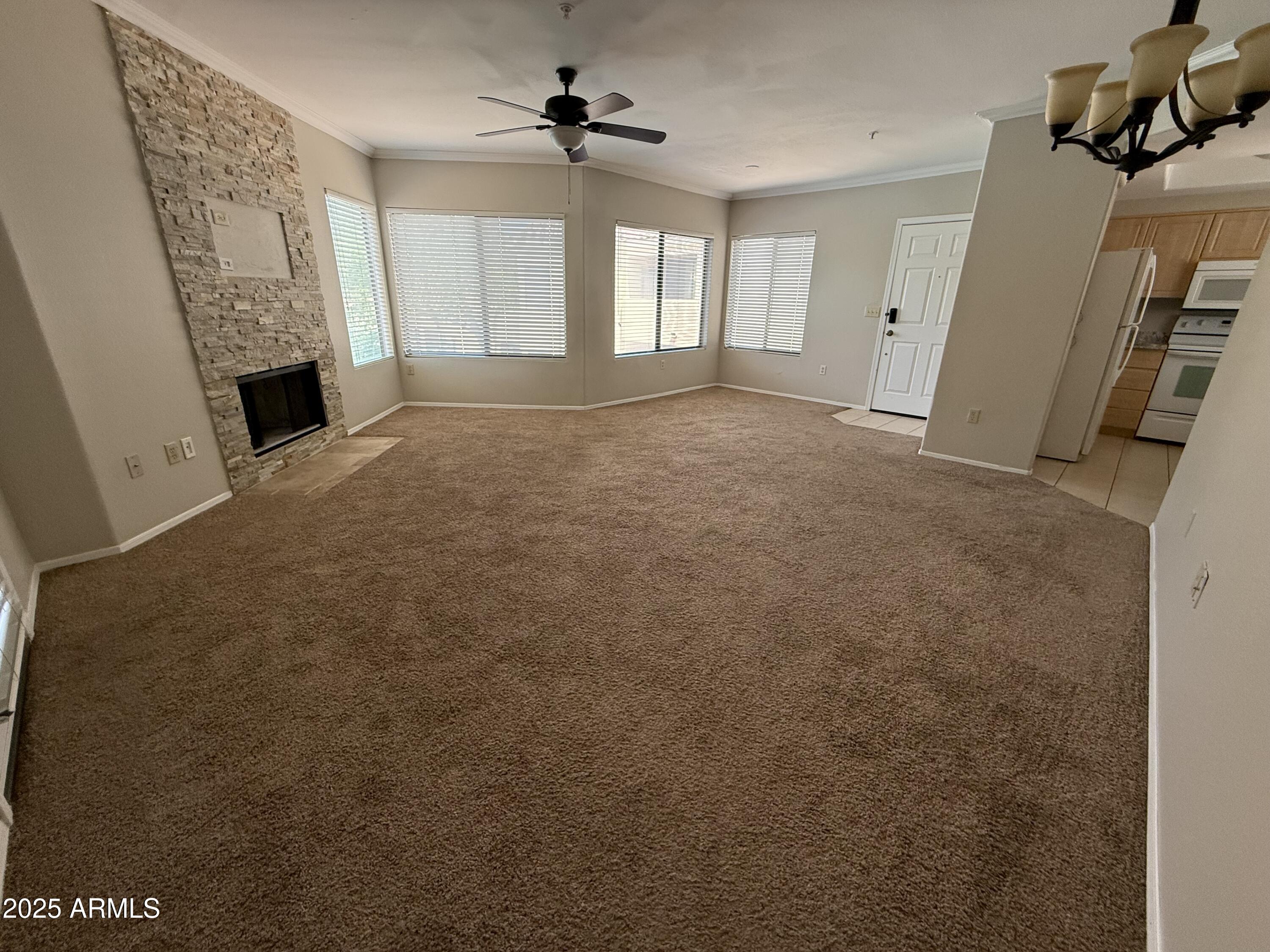 7575 East Indian Bend Road, Unit 2124 Scottsdale, AZ 85250 - Photo 6 of 32 a view of a livingroom with a fireplace