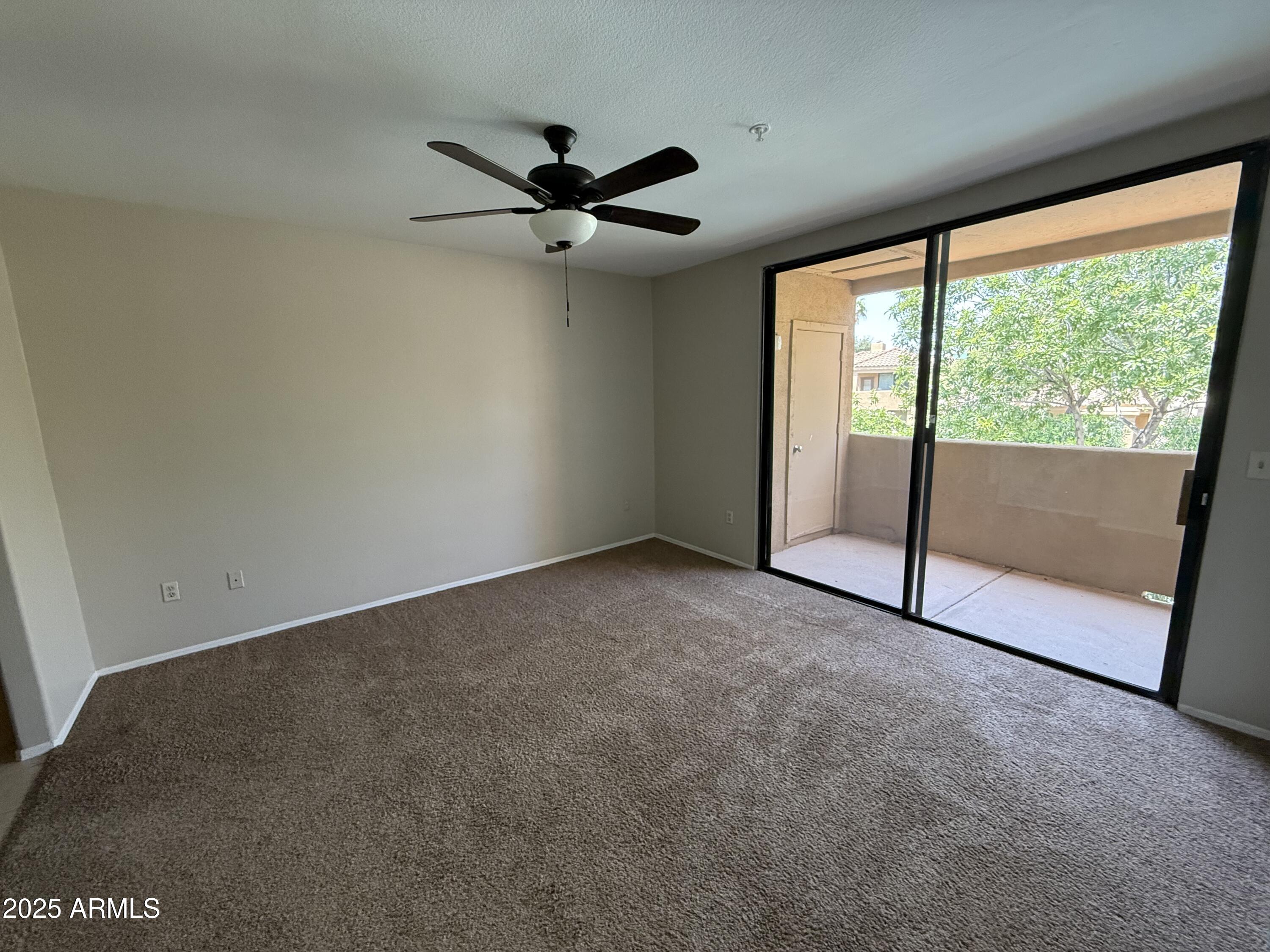 7575 East Indian Bend Road, Unit 2124 Scottsdale, AZ 85250 - Photo 7 of 32 a view of an empty room with a window