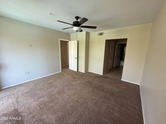 a view of a livingroom with a ceiling fan