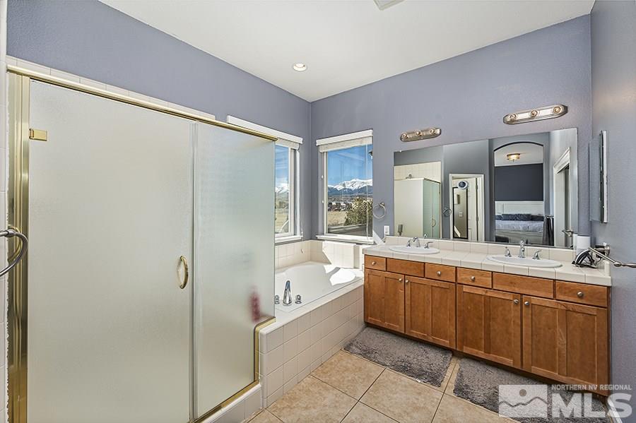 1630 Silver Thread Drive Reno, NV 89521 - Photo 11 of 17 a large bathroom with a large tub shower and sink