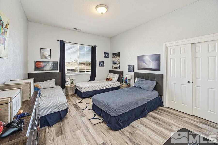 1630 Silver Thread Drive Reno, NV 89521 - Photo 13 of 17 a bedroom with furniture and a fireplace