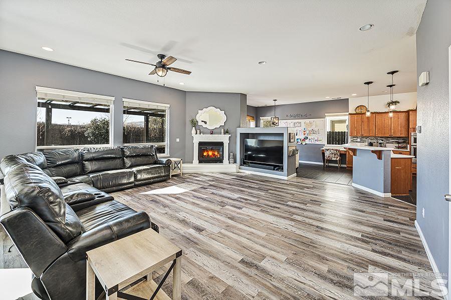 1630 Silver Thread Drive Reno, NV 89521 - Photo 5 of 17 a living room with furniture kitchen view and a fireplace