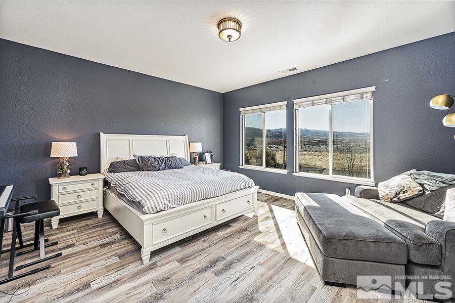 1630 Silver Thread Drive Reno, NV 89521 - Photo 10 of 17 a bedroom with a bed and wooden floor
