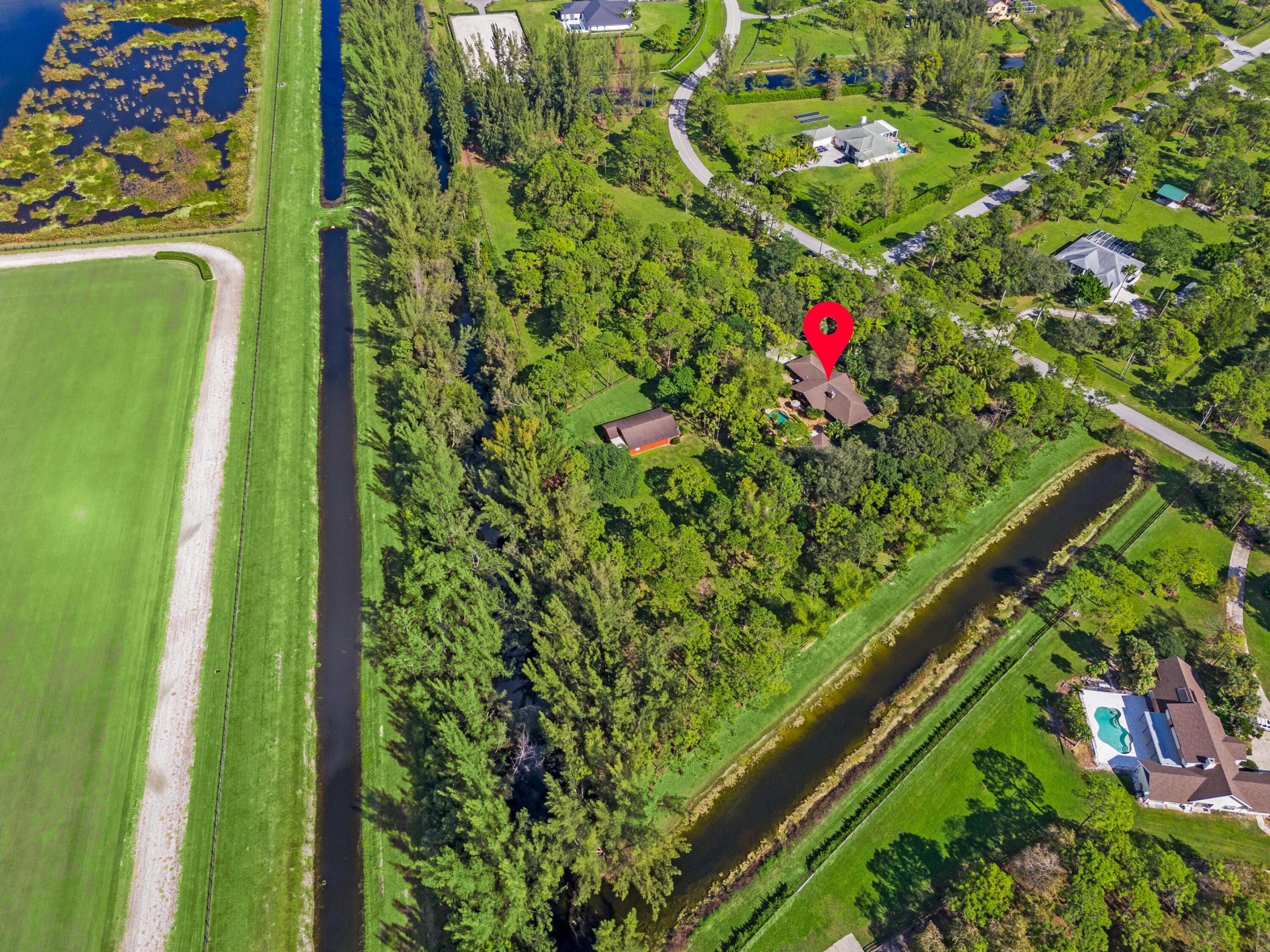 5405 Duckweed Road Wellington, FL 33449 - Photo 62 of 62 DJI_20241112105113_0235_D-Edit