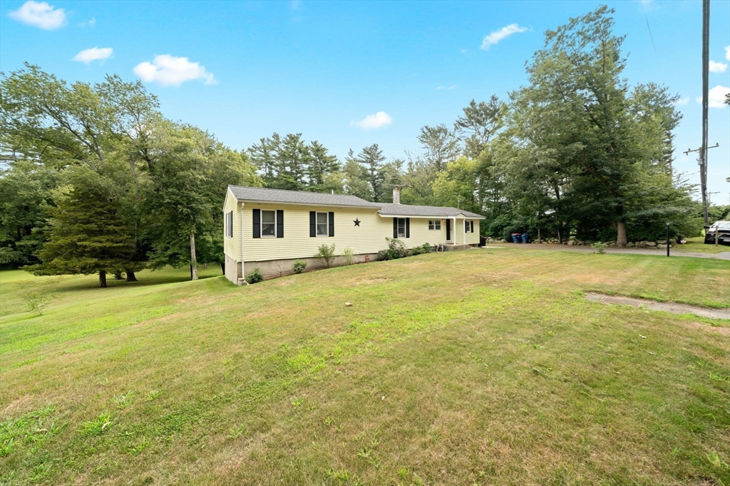 756 Snipatuit Road Rochester, MA 02770 - Photo 1 of 30 a view of a house with a backyard