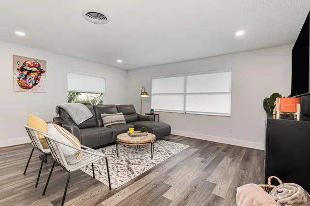 a living room with furniture and a window