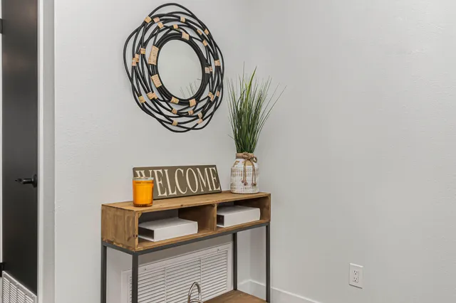 a view of a bathroom with a sink and a mirror