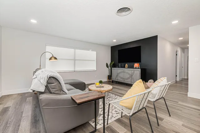 a living room with furniture and a window
