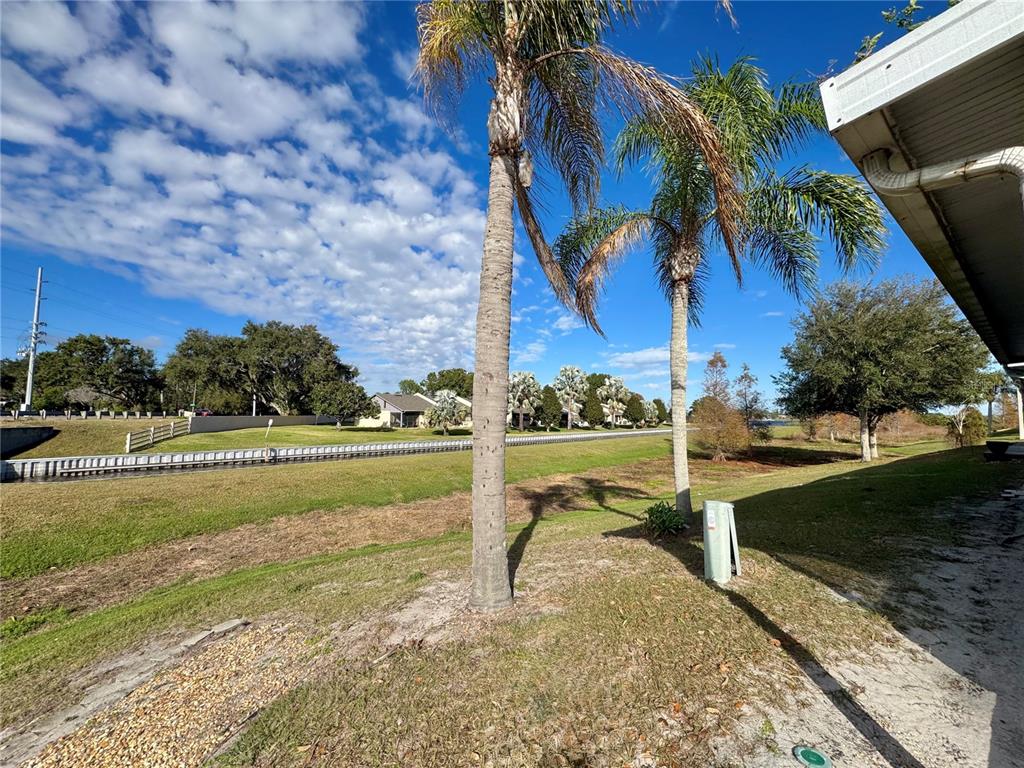 383 Winter Ridge Boulevard, Unit 383 Winter Haven, FL 33881 - Photo 24 of 35 a view of swimming pool with outdoor seating and plants