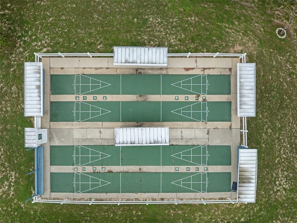 383 Winter Ridge Boulevard, Unit 383 Winter Haven, FL 33881 - Photo 30 of 35 a view of a house with a back yard