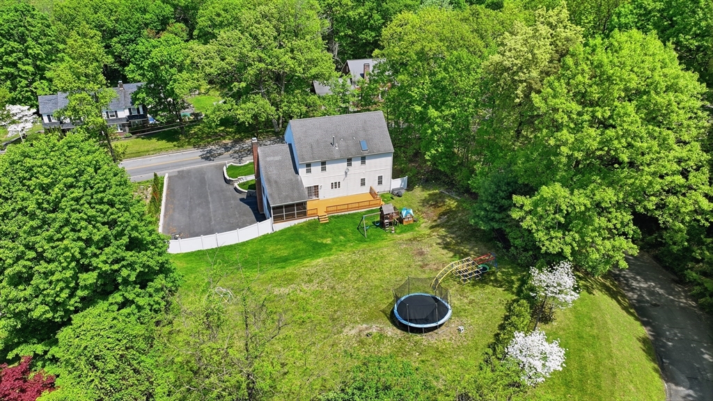 61 Indian Head Road Framingham, MA 01701 - Photo 4 of 42 an aerial view of a house with yard space and trees all around