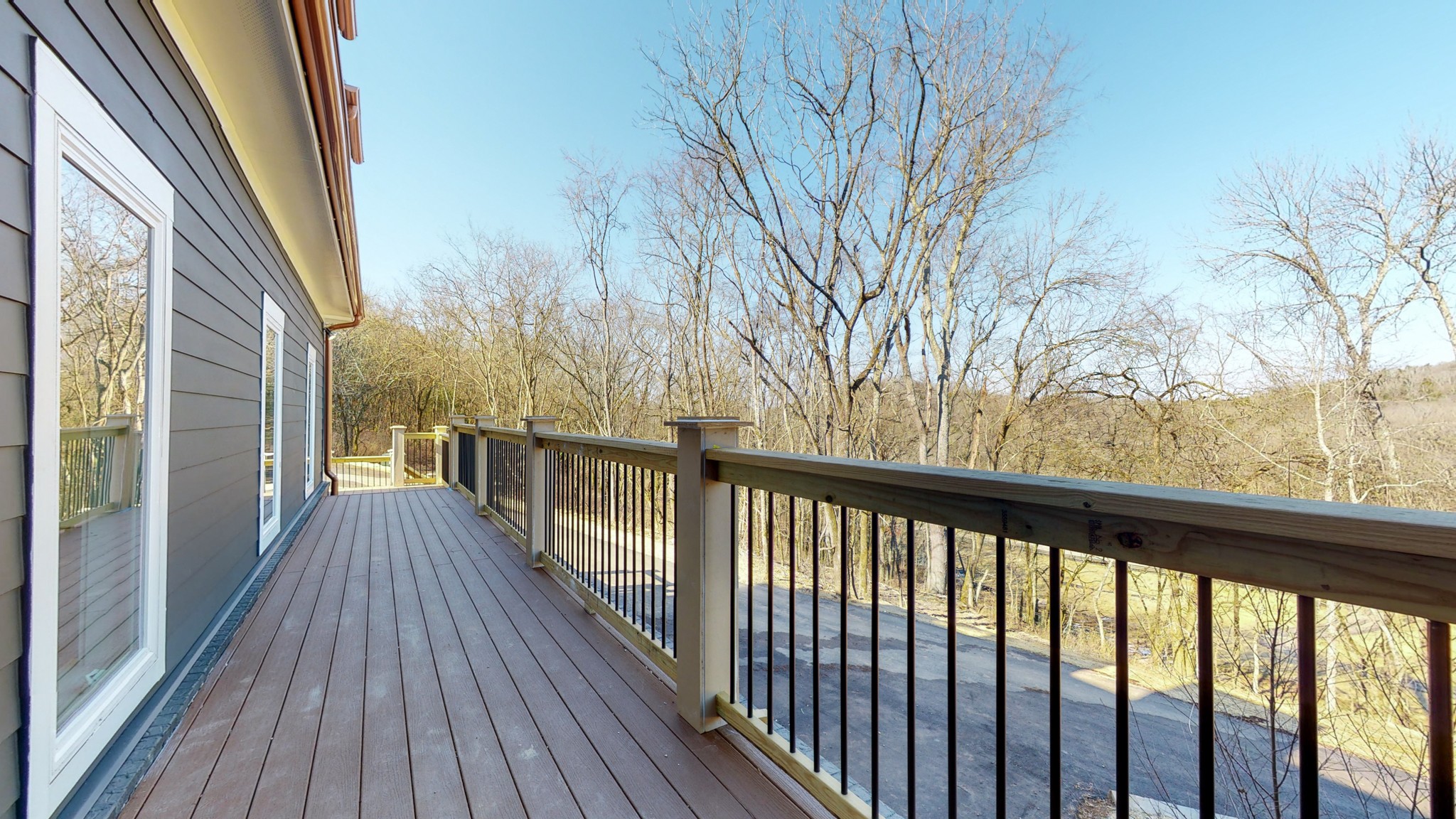 6720 Lane Road College Grove, TN 37046 - Photo 2 of 49 a view of a balcony with wooden floor and fence