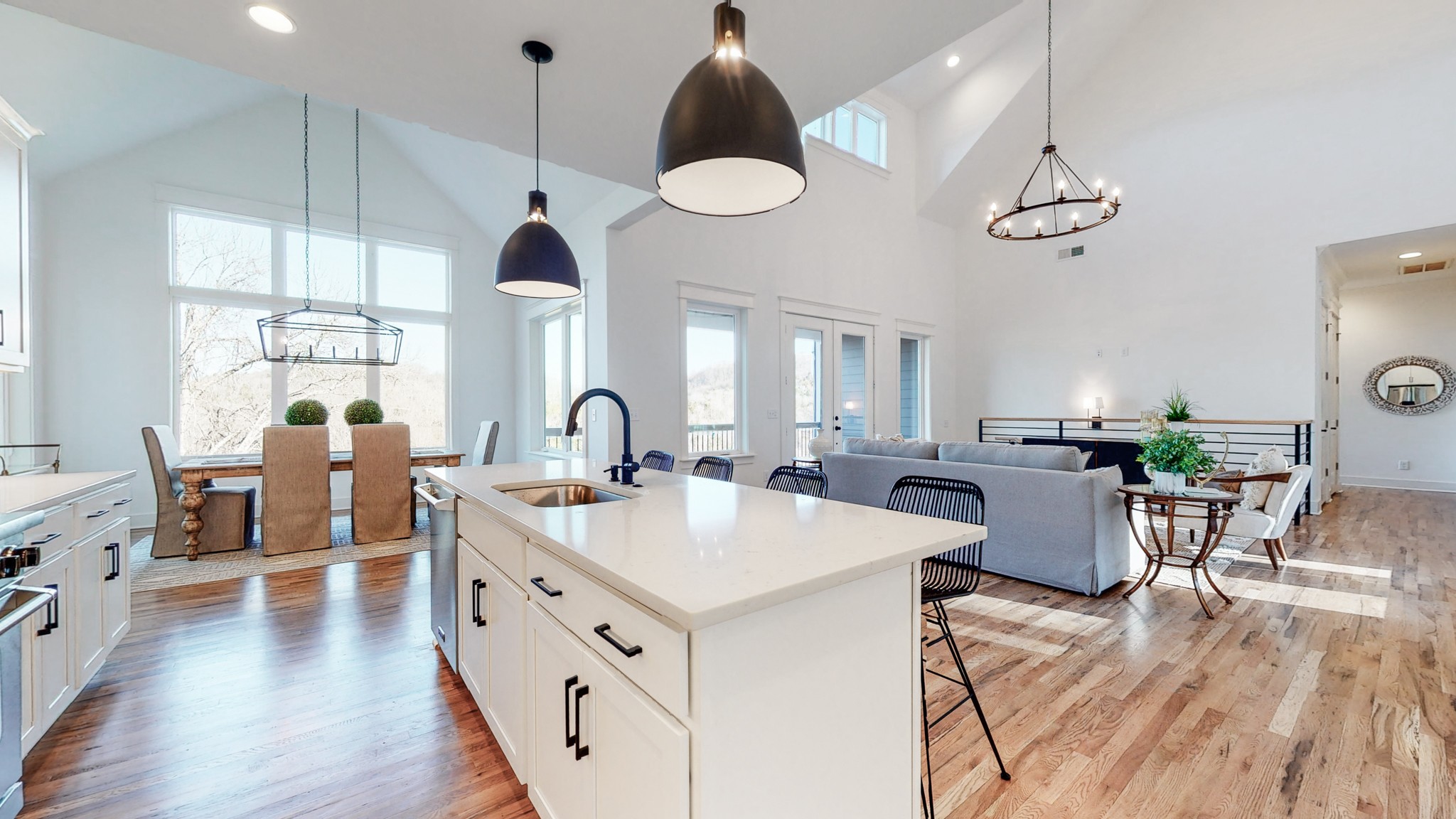 6720 Lane Road College Grove, TN 37046 - Photo 13 of 49 a very nice looking dining room with kitchen island stainless steel appliances a table chairs and a chandelier