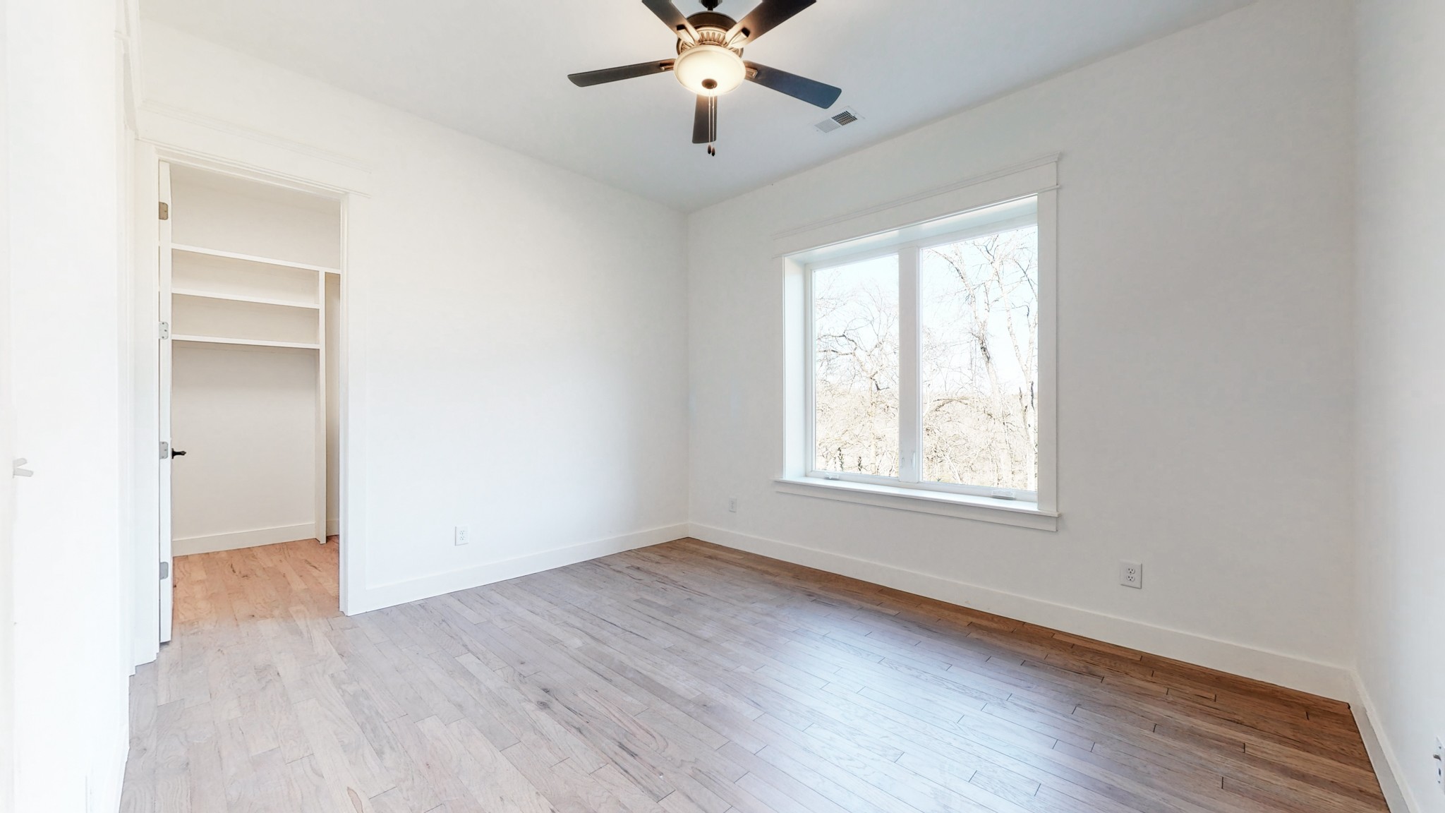 6720 Lane Road College Grove, TN 37046 - Photo 31 of 49 a view of an empty room with wooden floor and a window