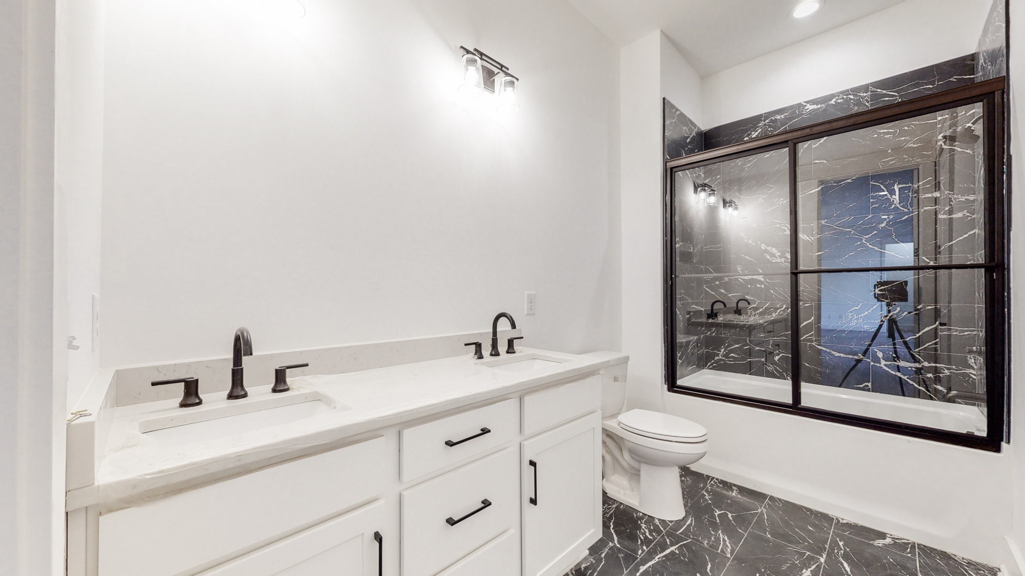 6720 Lane Road College Grove, TN 37046 - Photo 33 of 49 a bathroom with a sink a toilet and shower