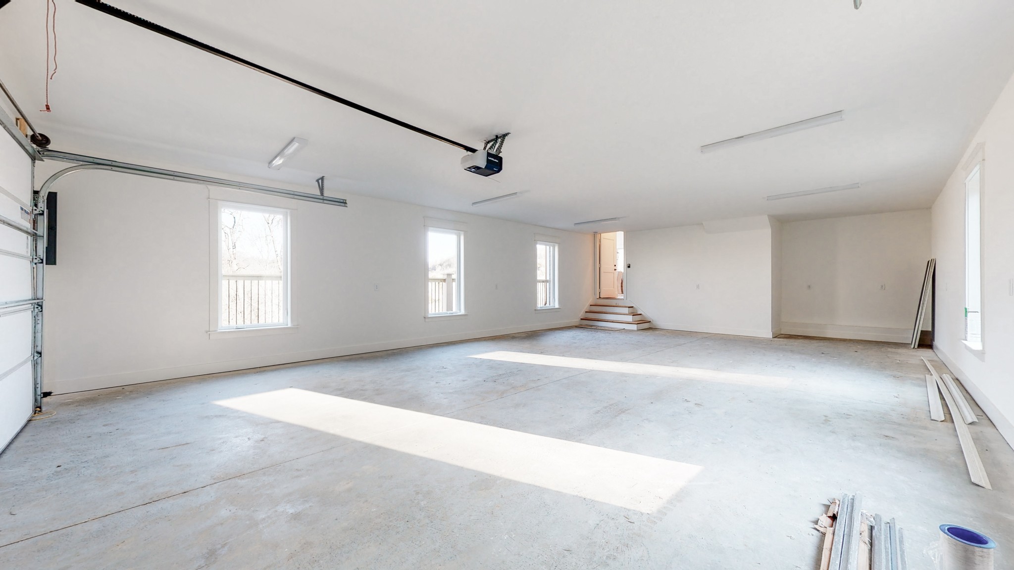 6720 Lane Road College Grove, TN 37046 - Photo 44 of 49 an empty room with windows and chandelier fan