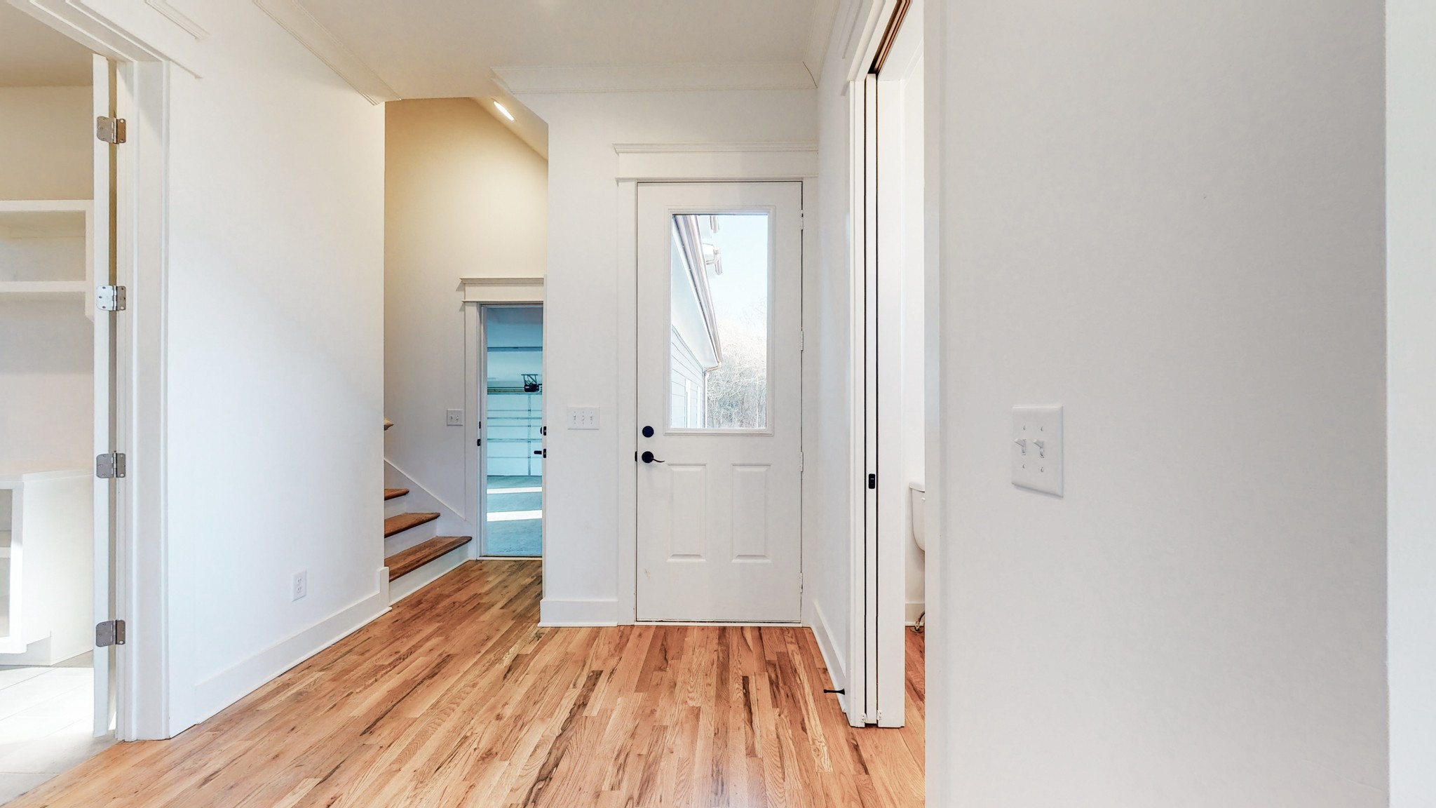 6720 Lane Road College Grove, TN 37046 - Photo 6 of 49 a view of a bathroom with wooden floor and a hallway