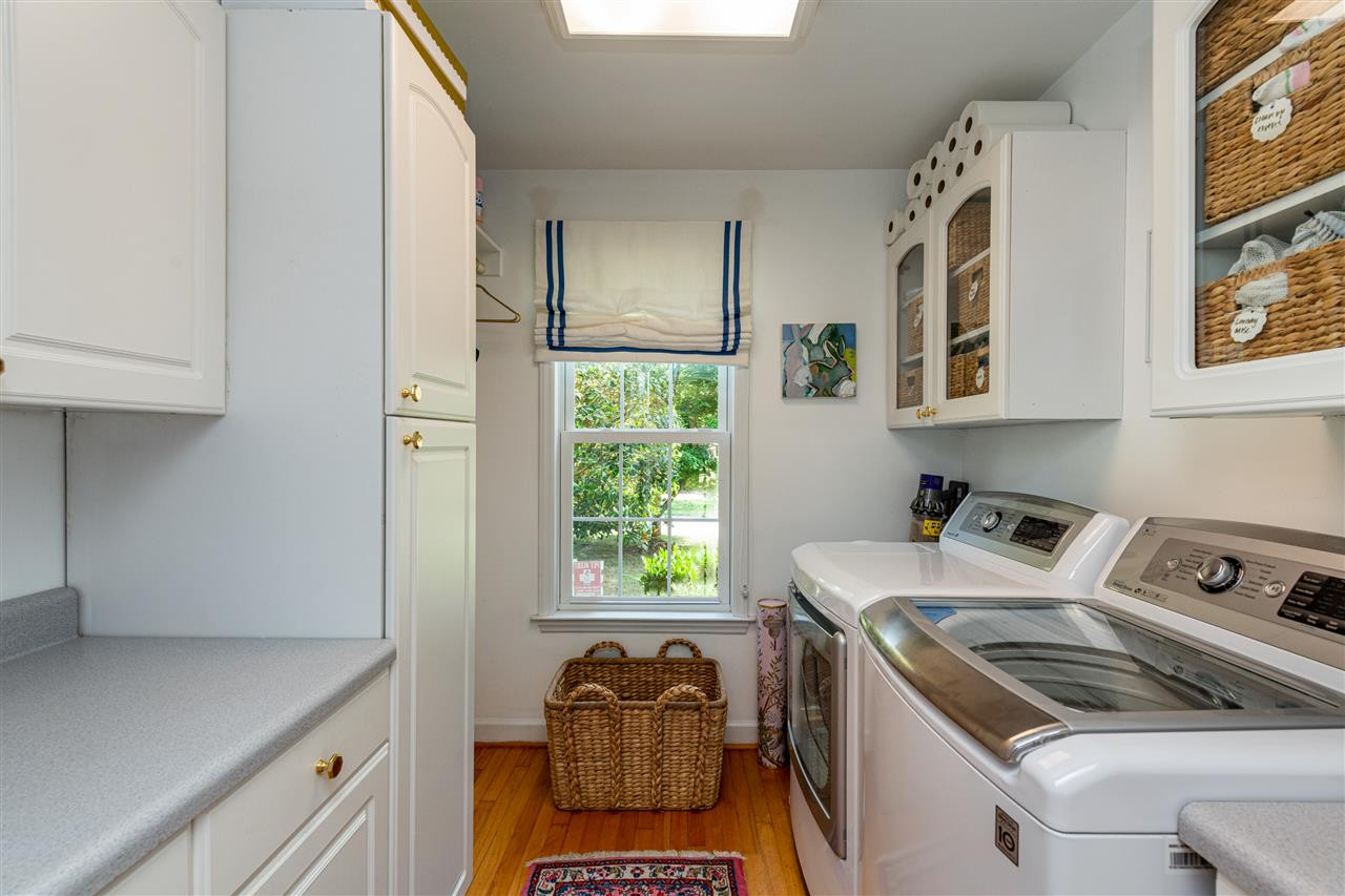 2705 Cooleemee Drive Raleigh, NC 27608 - Photo 23 of 30 Plenty of thought went into this space as well. You have natural light from a window and plenty of cabinet and counter top space. Laundry Room