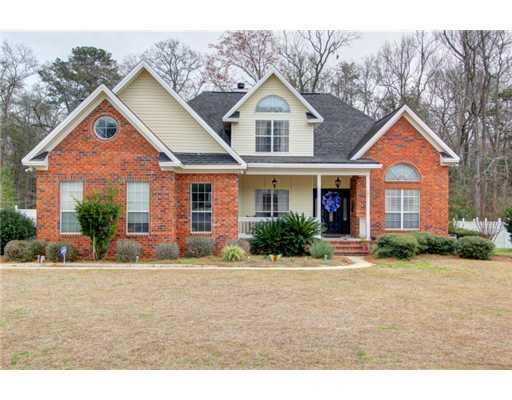 201 Partridge Court, Unit 62 Rincon, GA 31326 - Photo 1 of 1 a front view of a house with a yard