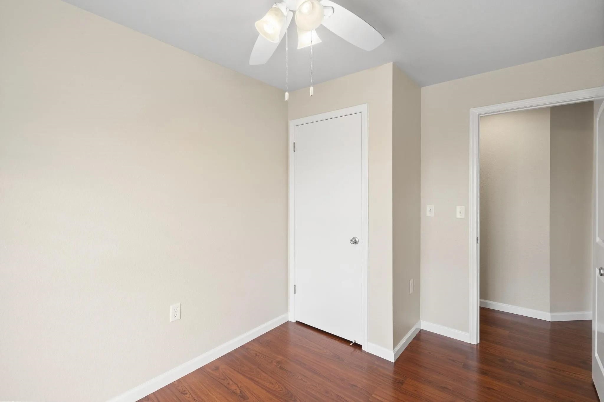 160 Keonekai Road, Unit 14202 Kihei, HI 96753 - Photo 14 of 21 an empty room with wooden floor and fan