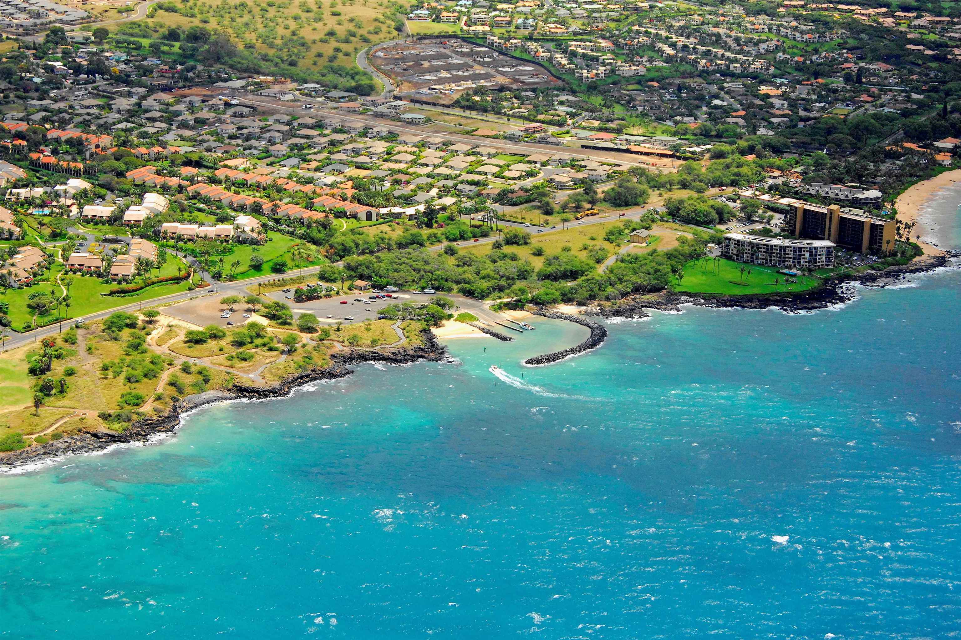 160 Keonekai Road, Unit 14202 Kihei, HI 96753 - Photo 18 of 21 a view of a golf course with parking space