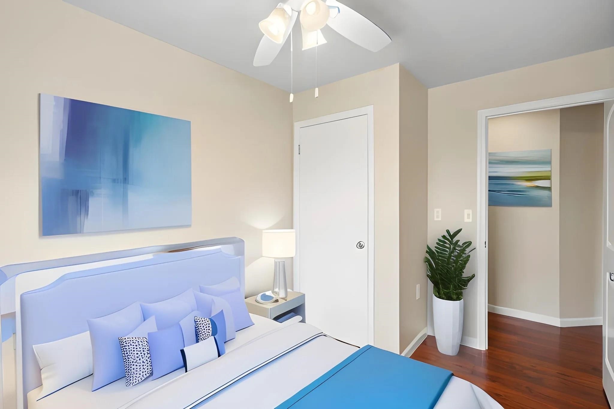 160 Keonekai Road, Unit 14202 Kihei, HI 96753 - Photo 6 of 21 a living room with a potted plant and wooden floor