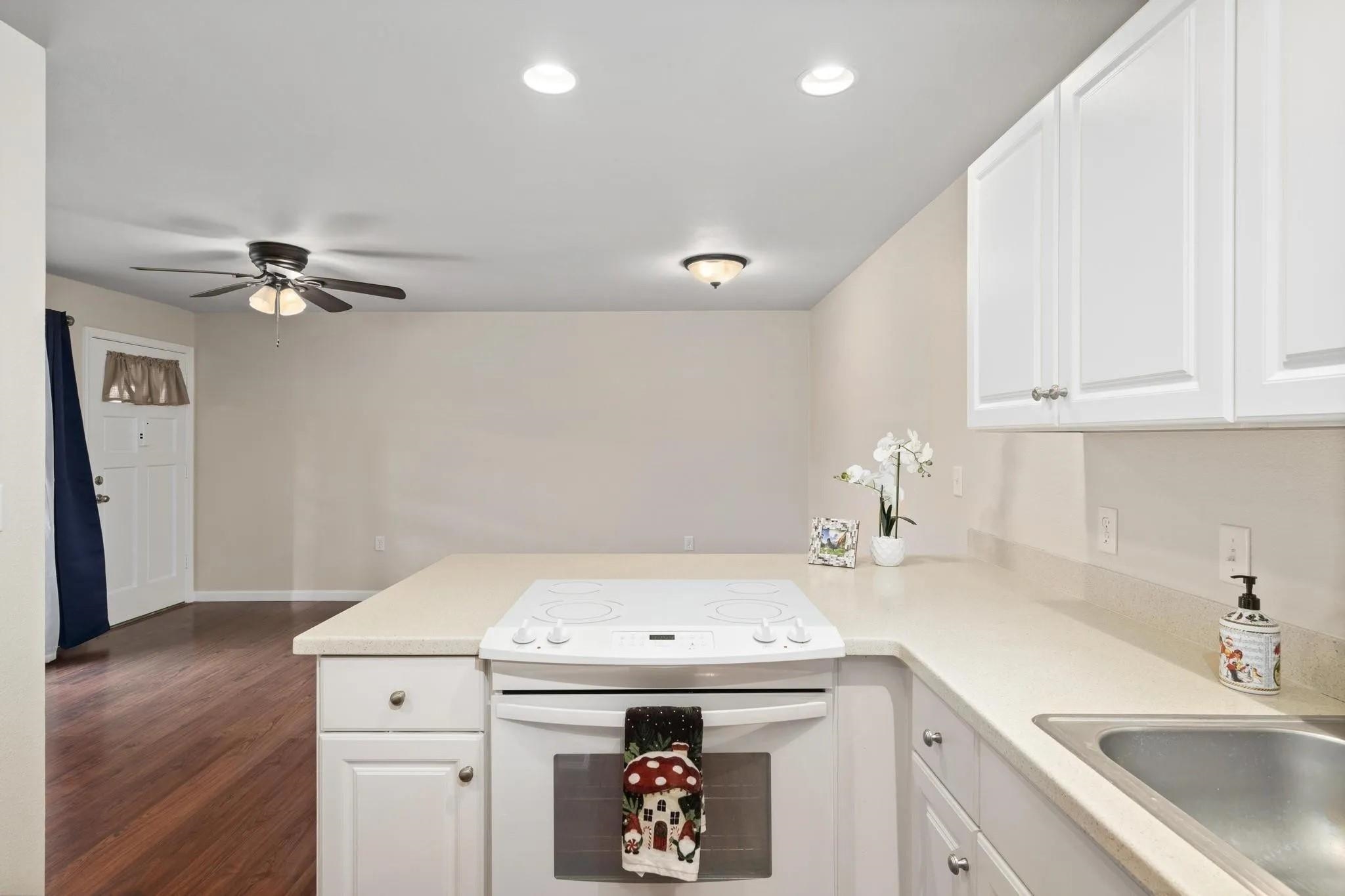 160 Keonekai Road, Unit 14202 Kihei, HI 96753 - Photo 10 of 21 a utility room with a sink a cabinetry and appliances