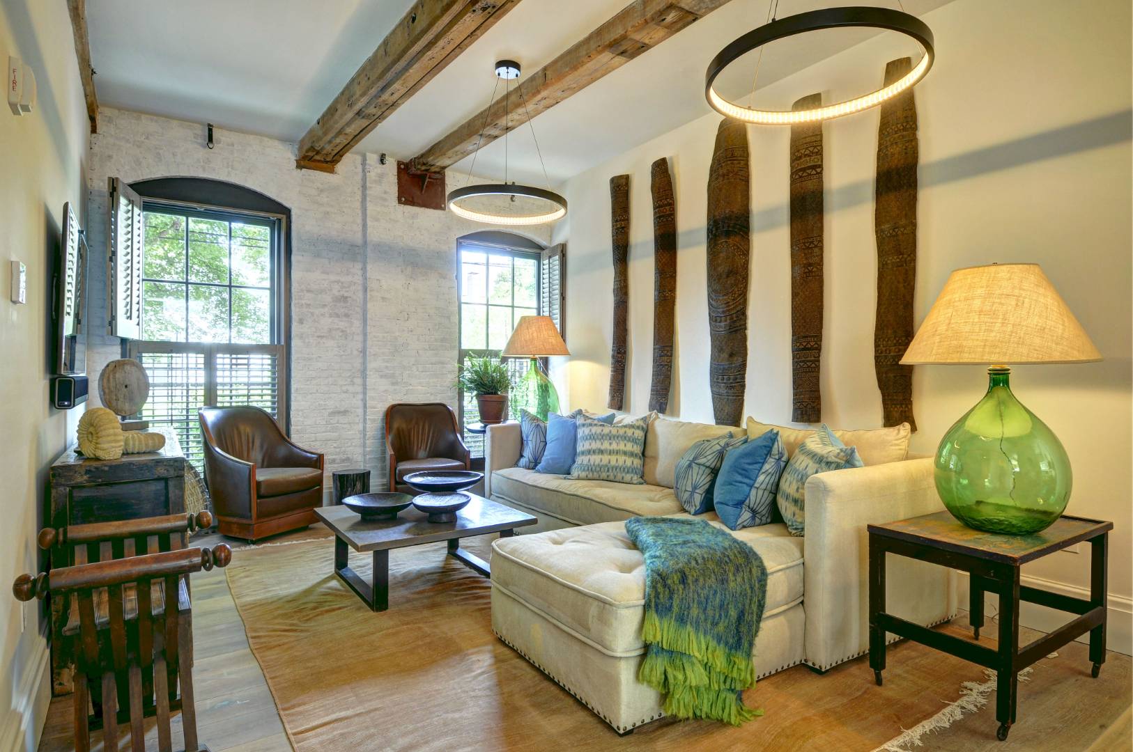 15 Church Street, Unit G106 Sag Harbor, NY 11963 - Photo 2 of 18 a living room with furniture and a window