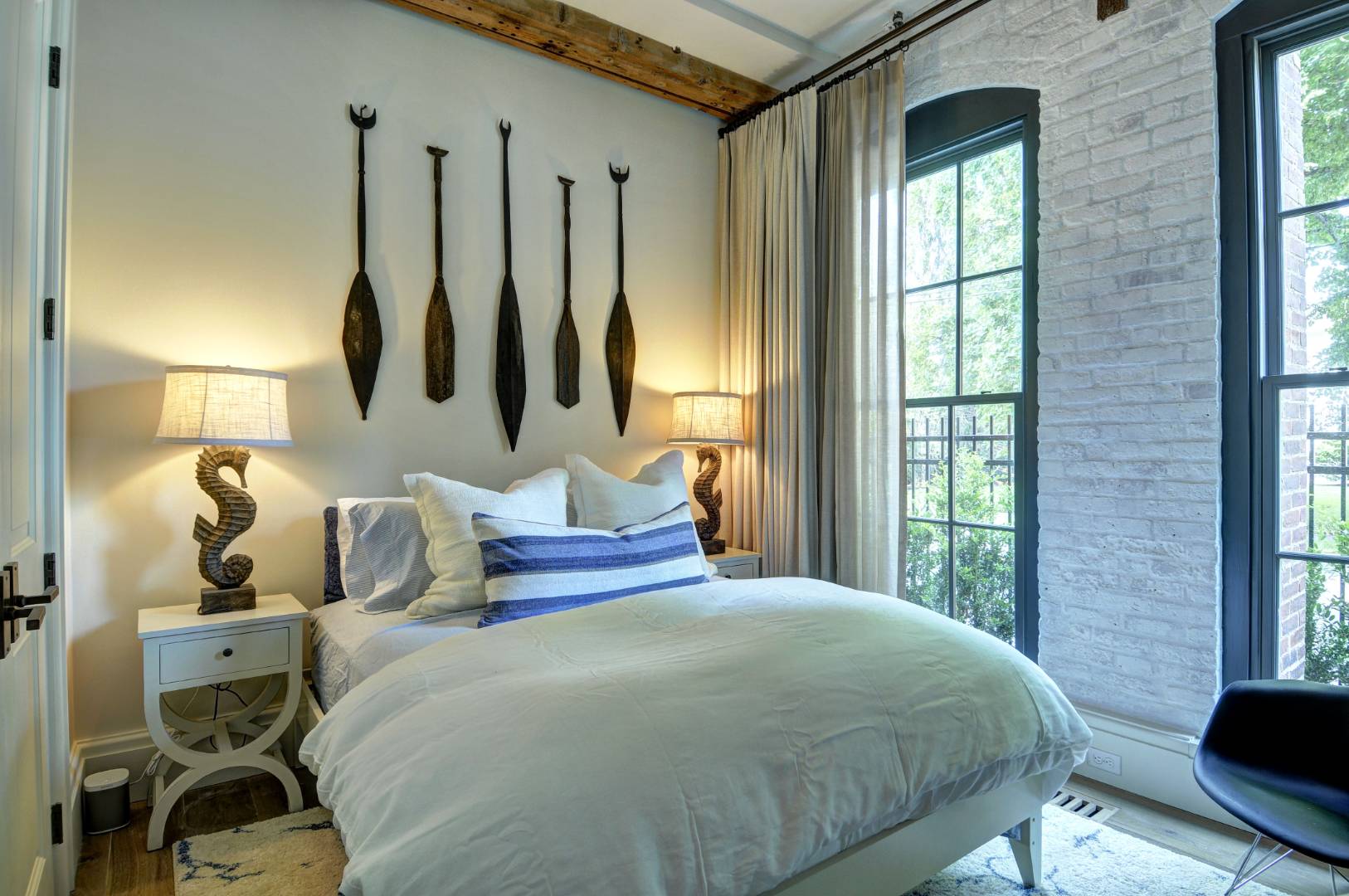 15 Church Street, Unit G106 Sag Harbor, NY 11963 - Photo 7 of 18 a bedroom with a bed and large windows