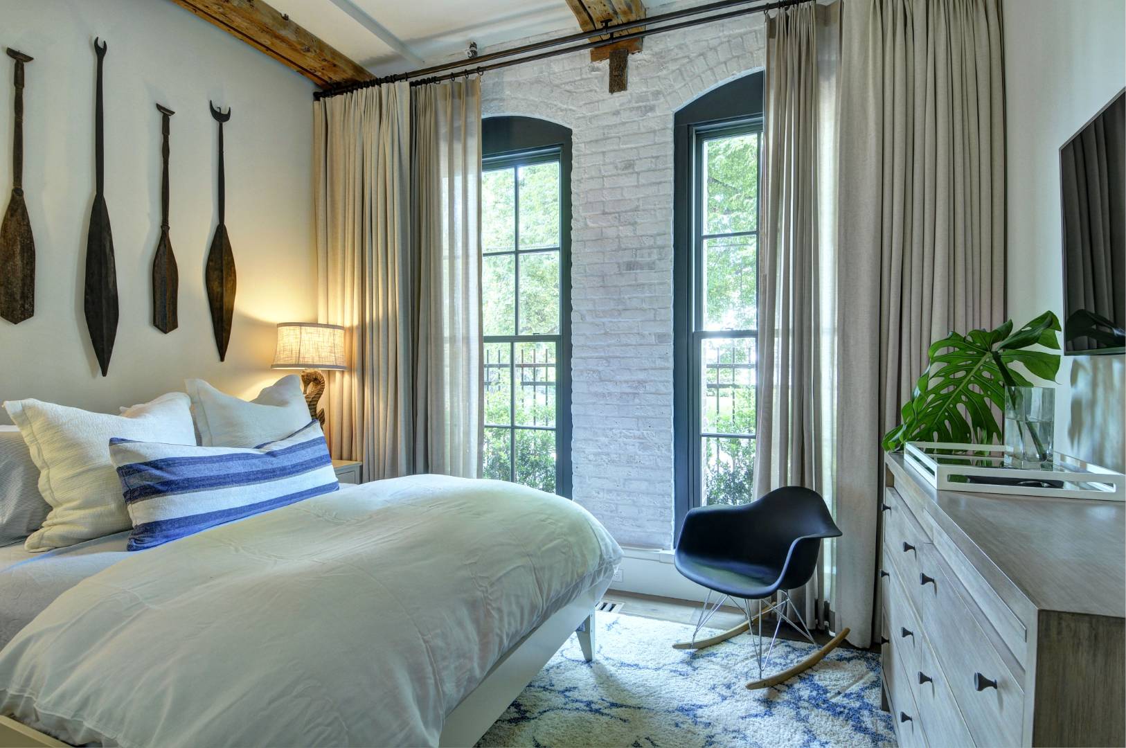 15 Church Street, Unit G106 Sag Harbor, NY 11963 - Photo 8 of 18 a bedroom with a bed and large windows