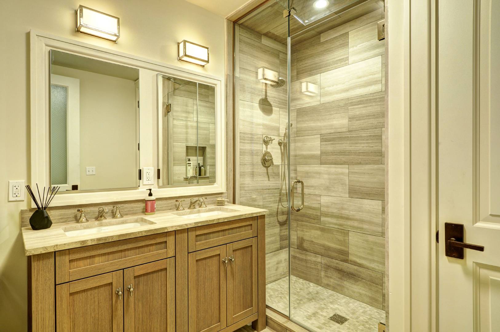 15 Church Street, Unit G106 Sag Harbor, NY 11963 - Photo 9 of 18 a bathroom with a shower sink and mirror