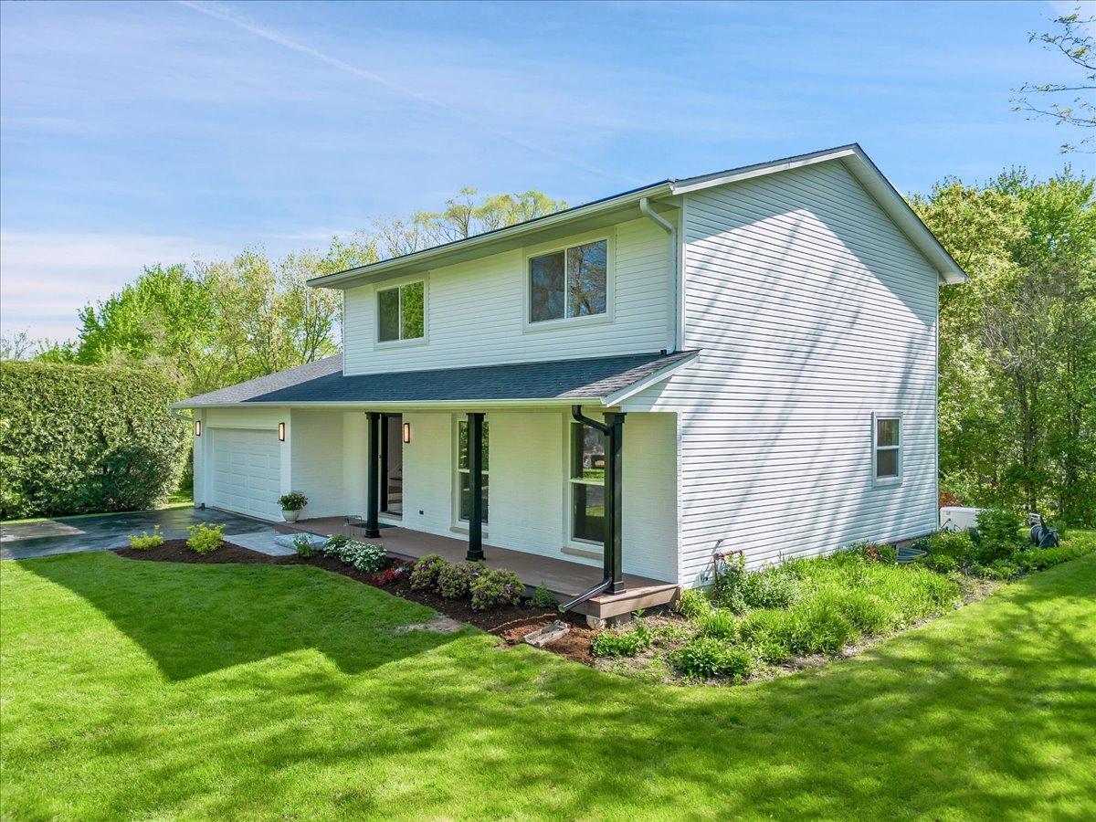 101 Devonshire Road, Unit 1 Tower Lakes, IL 60010 - Photo 2 of 38 a front view of house with yard and green space