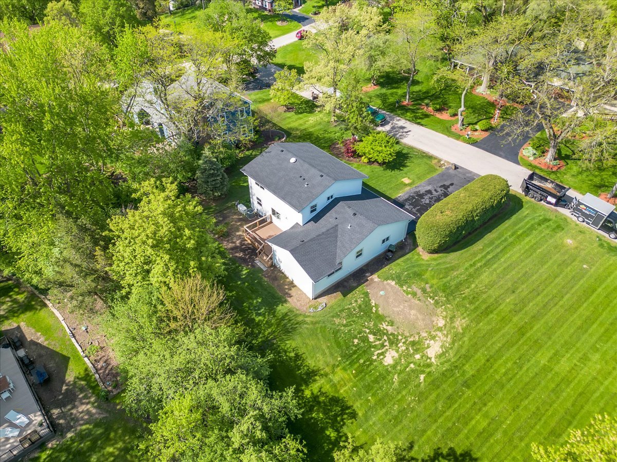 101 Devonshire Road, Unit 1 Tower Lakes, IL 60010 - Photo 5 of 38 an aerial view of a house with yard swimming pool and outdoor seating