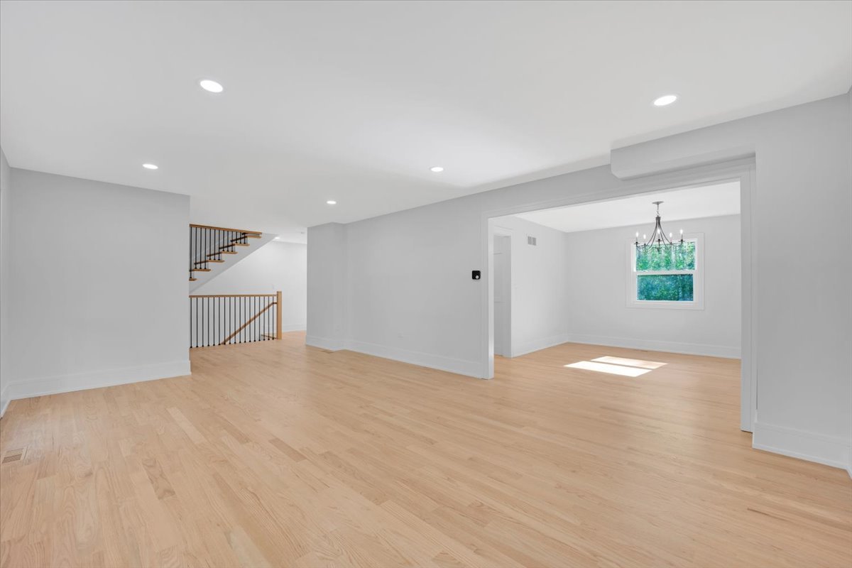 101 Devonshire Road, Unit 1 Tower Lakes, IL 60010 - Photo 9 of 38 a view of an empty room with wooden floor and a window