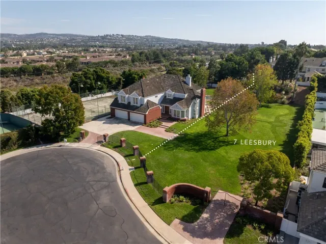 an aerial view of a house with a garden and outdoor space
