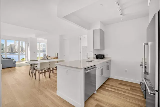 a kitchen with a table and chairs