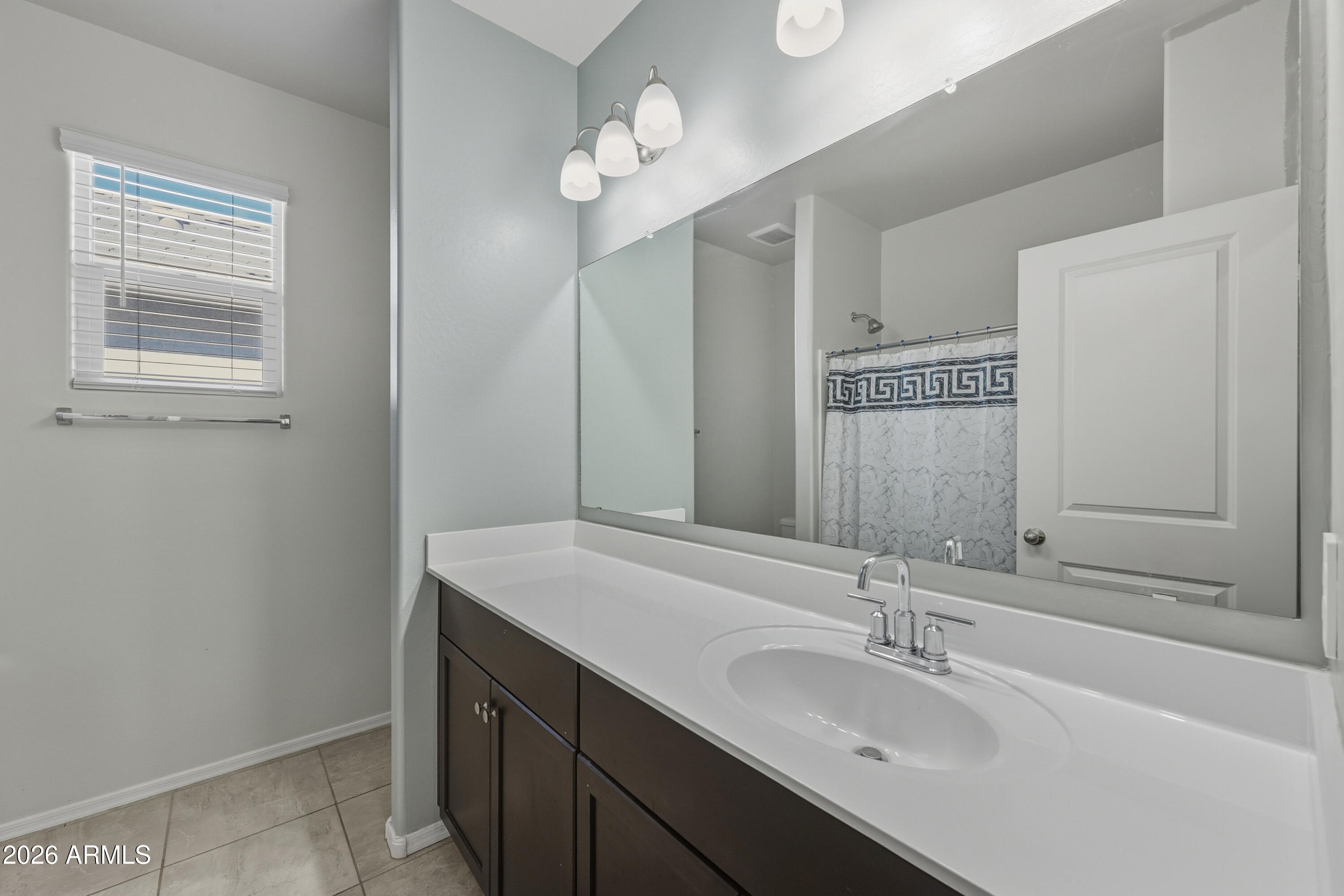 24136 Plow Road Florence, AZ 85132 - Photo 12 of 23 a bathroom with a sink vanity granite and a mirror