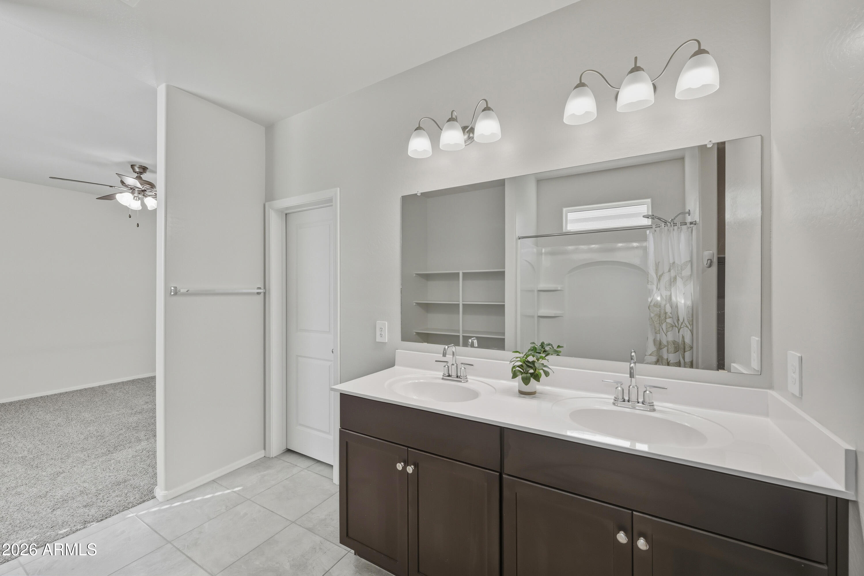 24136 Plow Road Florence, AZ 85132 - Photo 17 of 23 a bathroom with a sink double vanity and a mirror