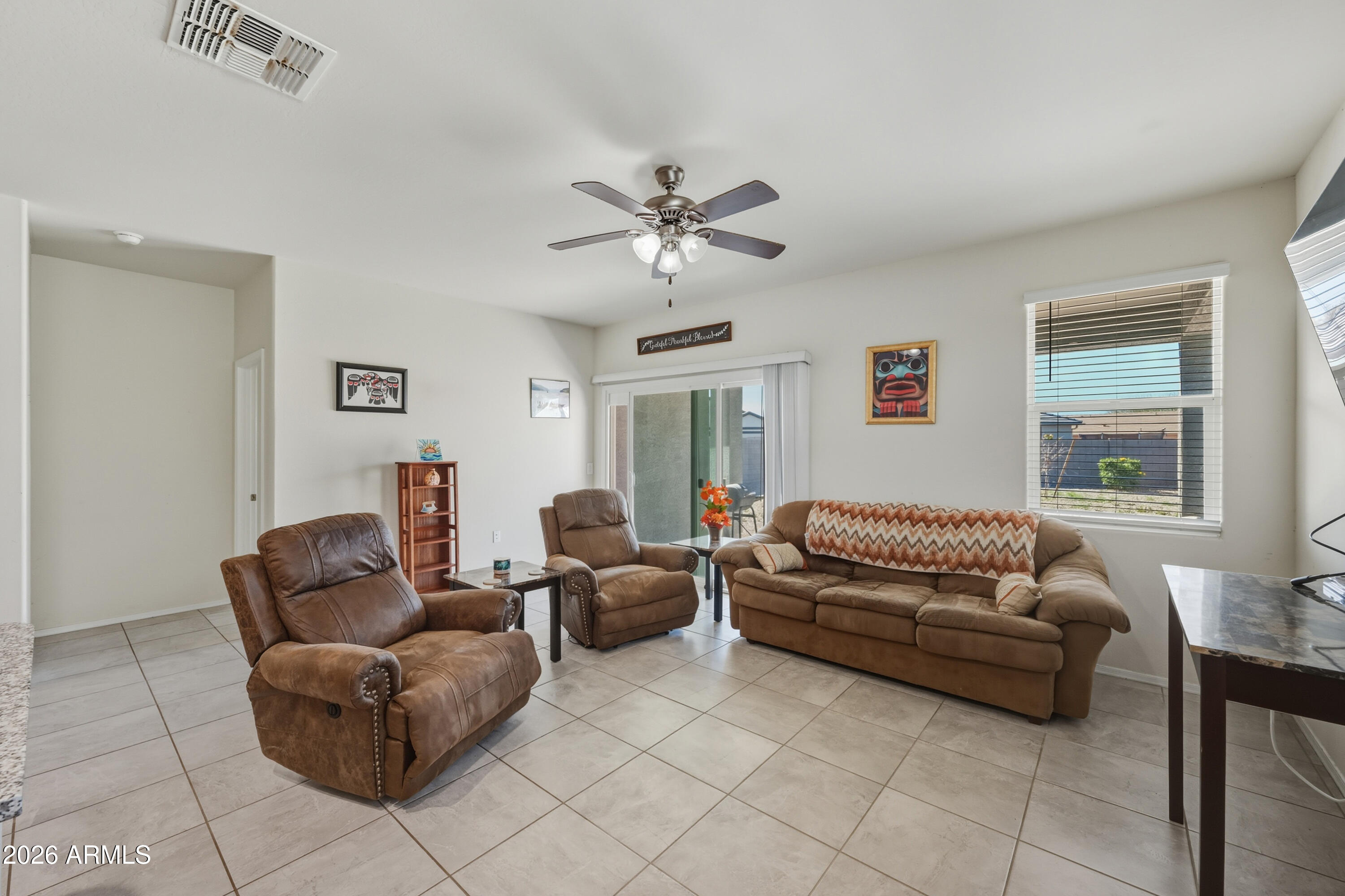 24136 Plow Road Florence, AZ 85132 - Photo 5 of 23 a living room with furniture and a window