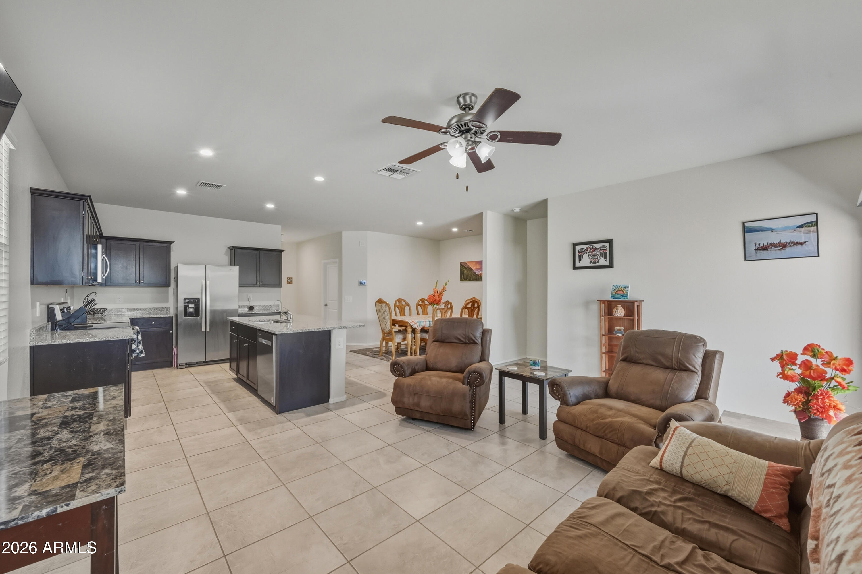 24136 Plow Road Florence, AZ 85132 - Photo 7 of 23 a living room with furniture and a view of kitchen