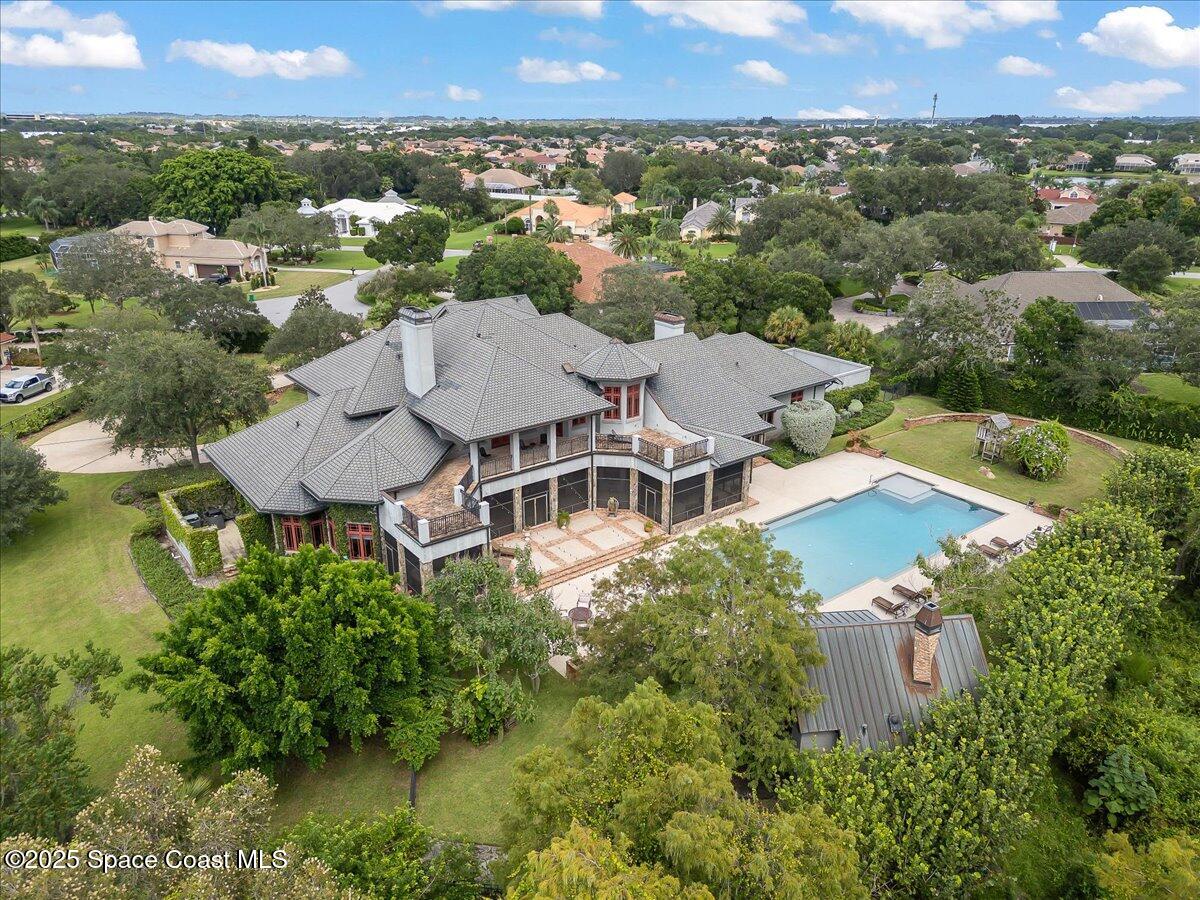 586 Wethersfield Place Melbourne, FL 32940 - Photo 101 of 112 an aerial view of a house with a garden