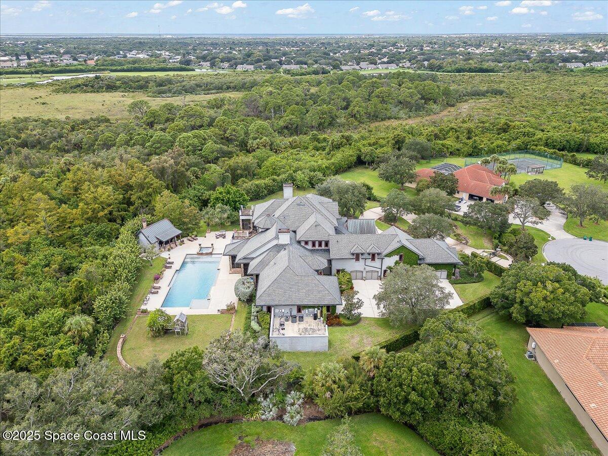 586 Wethersfield Place Melbourne, FL 32940 - Photo 104 of 112 an aerial view of residential houses with outdoor space and river