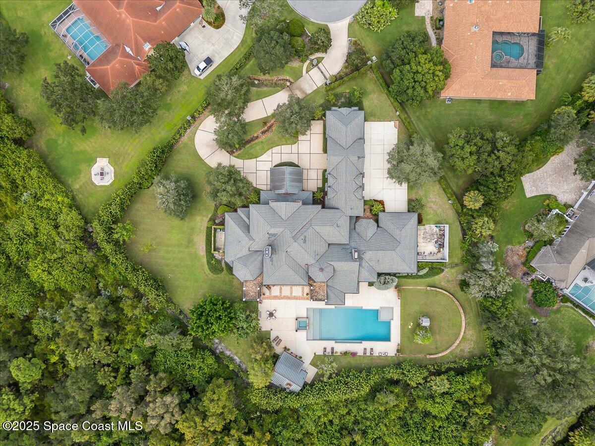586 Wethersfield Place Melbourne, FL 32940 - Photo 106 of 112 an aerial view of residential house with outdoor space and swimming pool