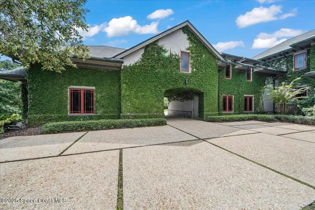 a kitchen with stainless steel appliances granite countertop a stove a sink dishwasher and cabinets with wooden floor