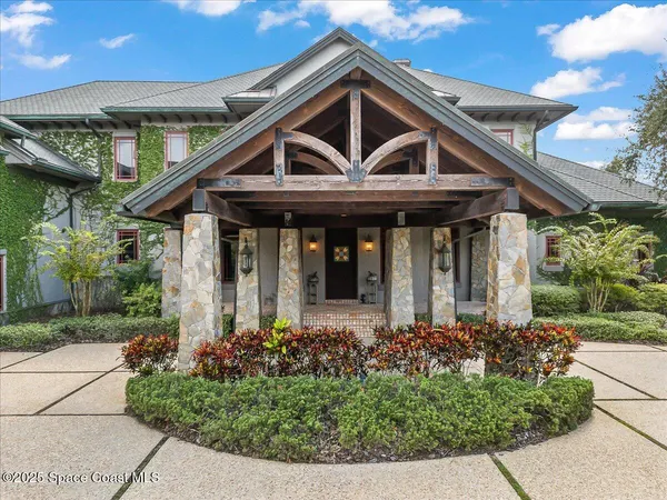 a kitchen with stainless steel appliances granite countertop a large stove a sink dishwasher and cabinets with wooden floor