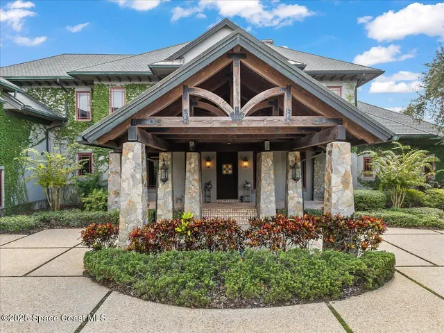 a kitchen with stainless steel appliances granite countertop a large stove a sink dishwasher and cabinets with wooden floor