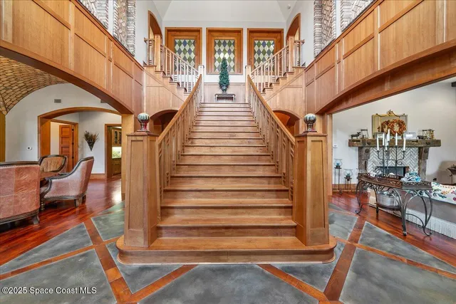a view of a house with swimming pool and sitting area