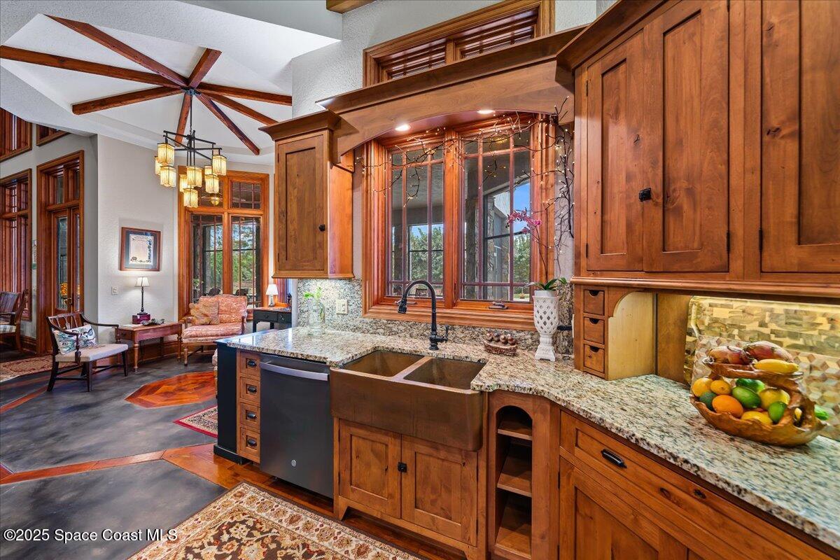 586 Wethersfield Place Melbourne, FL 32940 - Photo 25 of 112 a kitchen that has a lot of cabinets in it